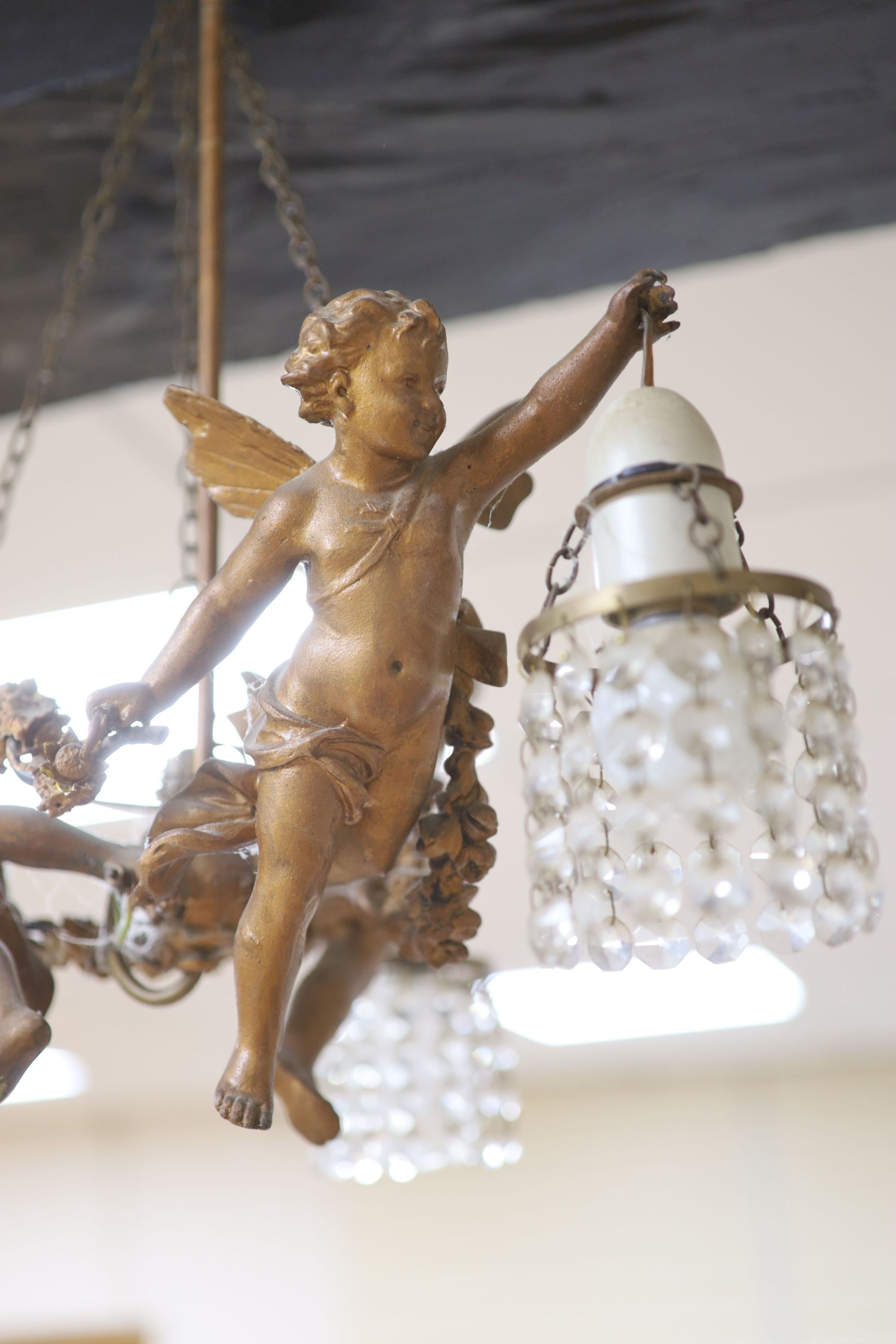 A metal framed ceiling lantern and a three branch cherub and lustre hung ceiling pendant (2)